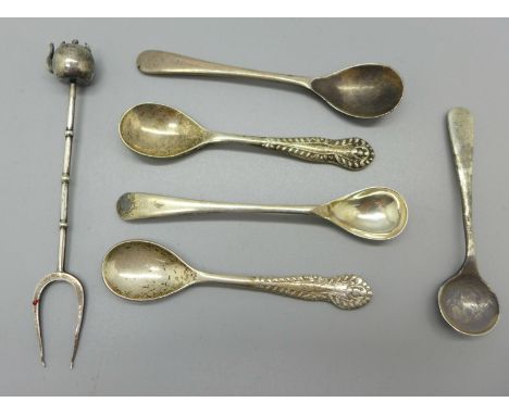Five silver salt spoons and an oriental silver two pronged fork with control marks 