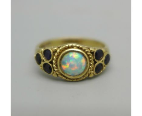 A 9ct gold, opal and garnet ring, 3.7g, O 