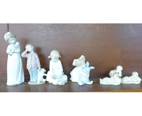 Two Lladro figures of young children sleeping, four Nao figures of children and a small Nao figure of a baby in a basket (7) 