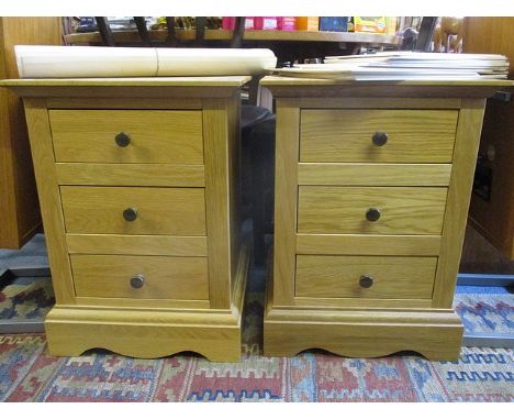 A pair of modern light oak bedside chests of drawers, 23 3/4 h x 17 3/4 w