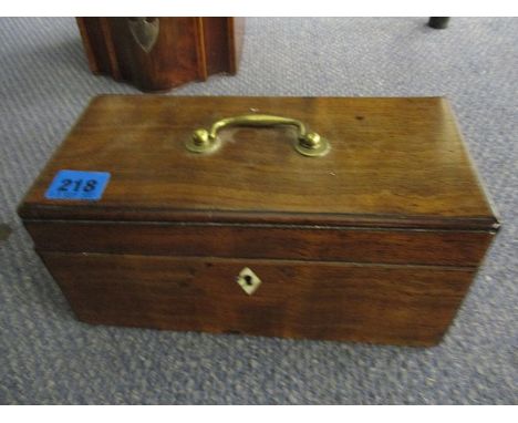 An early 19th century mahogany tea caddy with ivory escutcheons