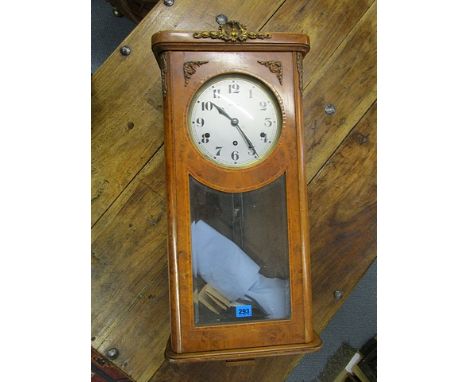A 20th century burr walnut cased wall clock with gilt metal mounts, the movement with a silvered dial and Arabic numerals