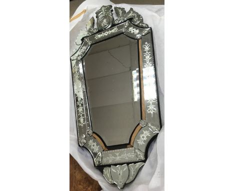 A large engraved Venetian glass mirror