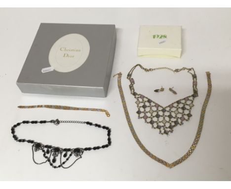 A Christian Dior necklace set with various coloured stones, a tri coloured jewellery set comprising ear rings, necklace and b