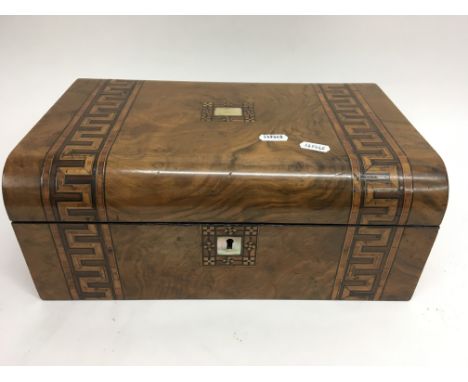 An Art Deco style writing box with key.