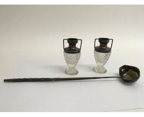 A silver toddy ladle with 2 silver topped mini vases.