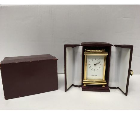A John Morley gold plated carriage clock in presentation case