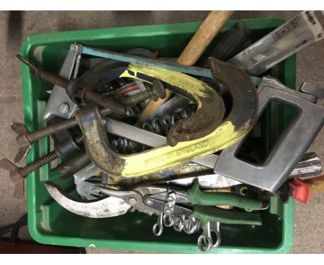 A box containing a collection of assorted hand tools including hacksaw, pliers etc