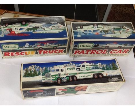 3 boxed "Hess " model vehicles including a rescue truck No 1994, patrol car No 1993 , and toy truck and helicopter No 1995.