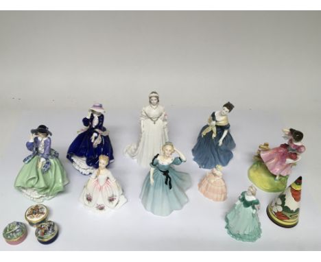 A collection of nine Royal Doulton figurines of various sizes, a Wedgwood Art Deco style shaker and three Doulton trinket box