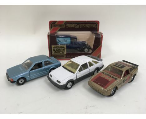 Four model cars with examples from Matchbox and Corgi.