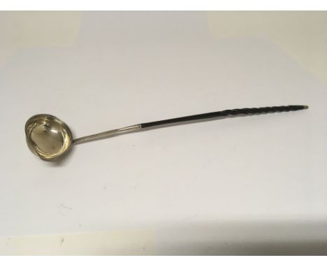 A George III silver and whale bone toddy ladle, marks slightly worn possible London hallmarks.