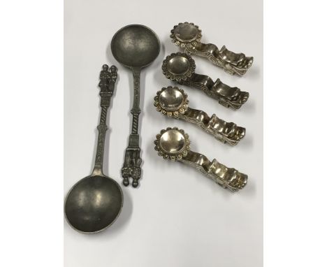 Two retrospective pewter spoons and four silver plated chopstick stands.