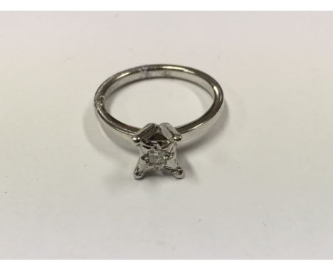 An 18ct white gold ring set with a twelve point princess cut diamond, approx size K-L and 3.5g.