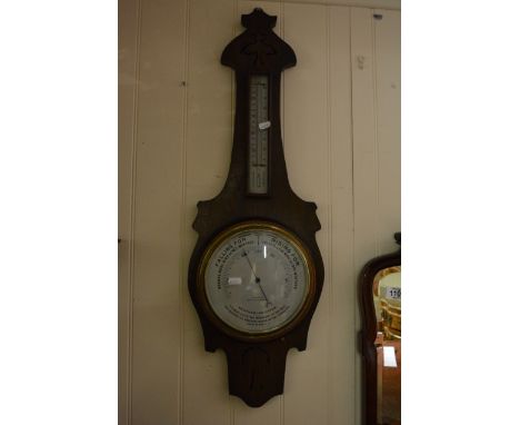 An Oak barometer with a silvered dial the dial with the inscription Boatman Southend,