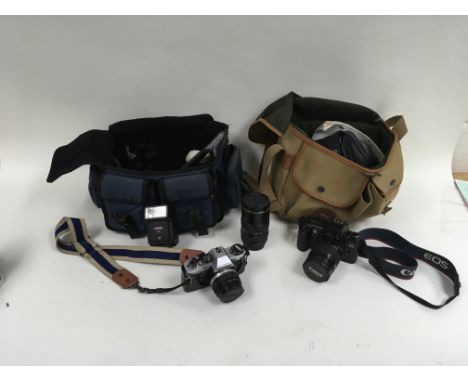 A box containing various cameras and camera accessories, this includes camera bags, slings and memory card holders. Also incl