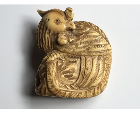 A Japanese Netsuke of the early Meiji period 19th Century, carved in the form of a stylised bird, signed base 4cm.