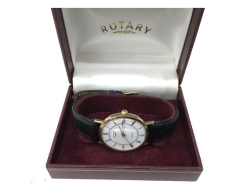 A 9ct yellow gold Rotary watch with black leather strap. Boxed.