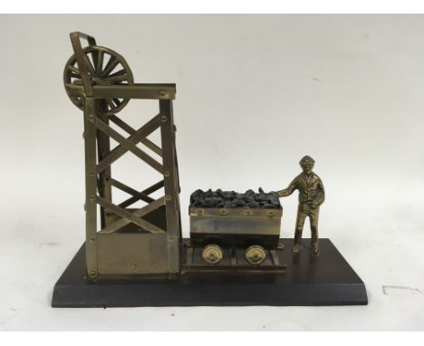 A brass model of a coal mining operation