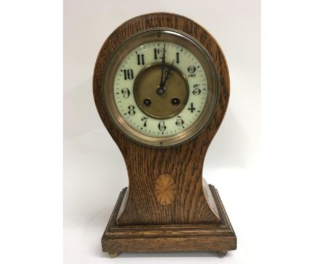 A balloon shape inlaid mantel clock