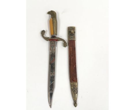 A Toledo dagger, the handle formed as a bird of prey with engraved blade and leather sheath