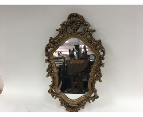Three wall hanging mirrors including one giltwood mirror.