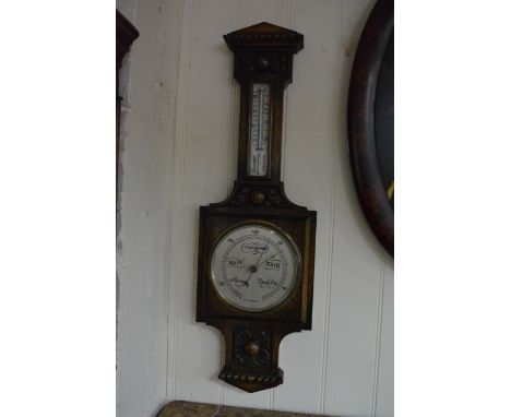 An Oak Wall Barometer with fitted silver dial