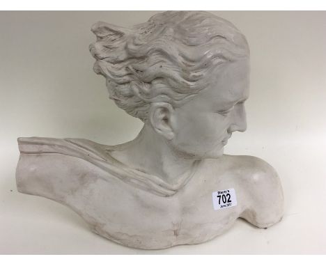 A reproduction Art Deco style plaster bust of a stylised man's head.Approximately 29x37cm long