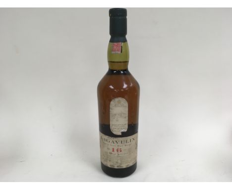 An unboxed bottle of Lagavulin Scotch whisky aged for 16 years.