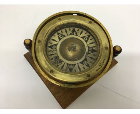 A brass ships compass.