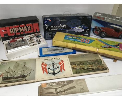 A collection of model and remote control vehicles including a ripmax remote control and LAMAV4 R/C helicopter. Also included 