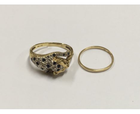 Two 18ct gold rings comprising a gold band, approx L and one in the form of a leopard set with small sapphires (a/f), approx 