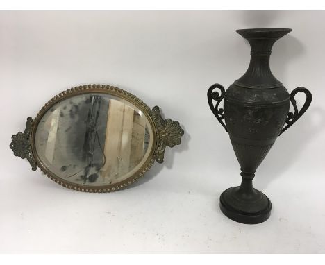 A spelter neo-classical vase and a mirror, some damage.