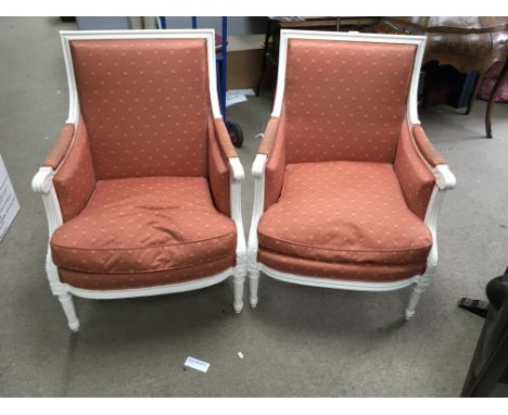 A pair of white painted open armchairs with upholstered back and seat on turned tapered legs. One other light painted armchai