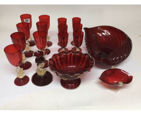 A collection of Morano ruby glass, comprising of 7 wine glasses, 6 smaller matching wine glasses, a large shell shaped bowl a