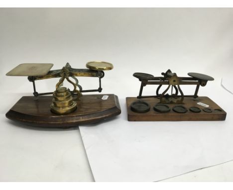 Two sets of beam balance postal scales.