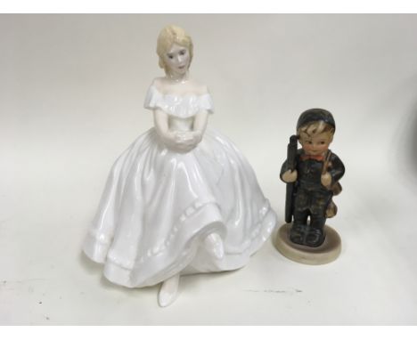 A Royal Doulton figure of a lady sitting "Heather"and a West German figure of a small boy holding a ladder.