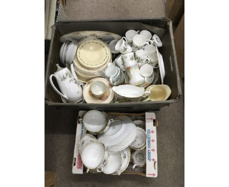 Two boxes of various part tea and dinner service items.