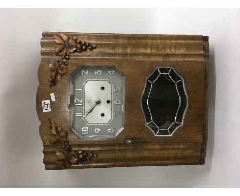 4 Airs Depose Art Deco walnut wall clock with silver dial and visible pendulum. Approximately 23x19 inches.