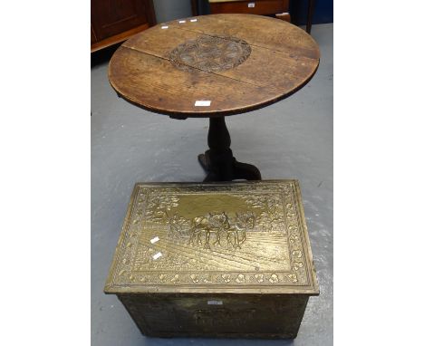 19th century oak snap top circular tripod table together with a repoussé brass log box. (2) (B.P. 21% + VAT) Top is carved an