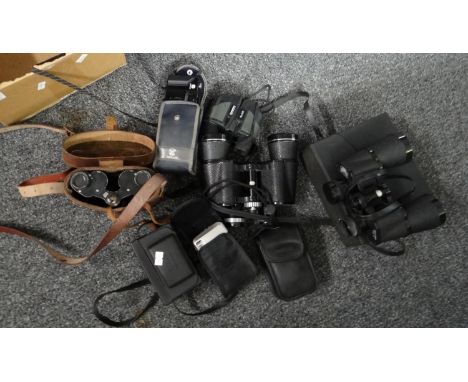 Box of cameras in cases and binoculars to include: Youngs Leicester Astral 10x50 field binoculars, pair of field glasses in l