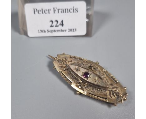 Victorian 9ct gold ruby and diamond brooch.  5.4g approx.  (B.P. 21% + VAT) 