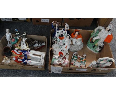 Two boxes of china, mostly Staffordshire Flat Back figures and spill vases to include: two gentlemen with a clock, Huntsman w