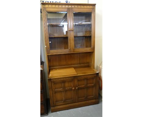 Elm Ercol display cabinet.  (B.P. 21% + VAT) 