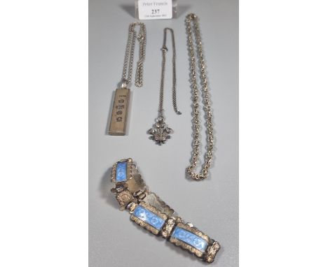 Bag of silver to include: silver ingot on chain, another silver chain with three feathers pendant, blue enamel bracelet marke