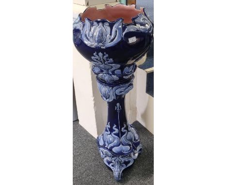 Art Nouveau design blue ceramic jardinière on stand, the jardinière with impressed marks 'Vulcan', standing 115cm high approx