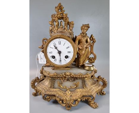 Early 20th century, probably French, gilt metal and alabaster two train figural mantle clock, with key and pendulum.  (B.P. 2
