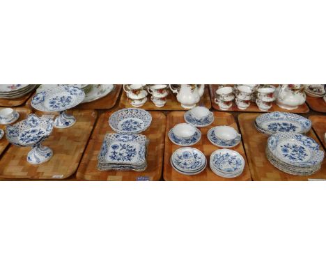 Four trays of blue and white Meissen porcelain 'Blue Onion' design items to include: teacups and saucers, small dishes, vario