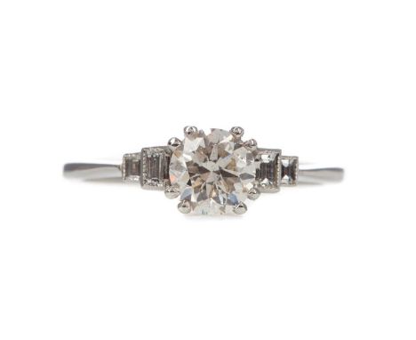 CERTIFICATED DIAMOND RING,set with a central round brilliant cut diamond of approximately 0.90 carats flanked by baguette cut