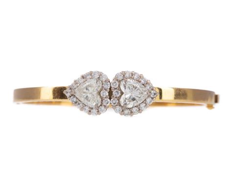HEART SHAPED DIAMOND BANGLE BY ERIC SMITH OF GLASGOW,the heart shaped diamonds weighing approximately 2.53 and 2.57 carats, e